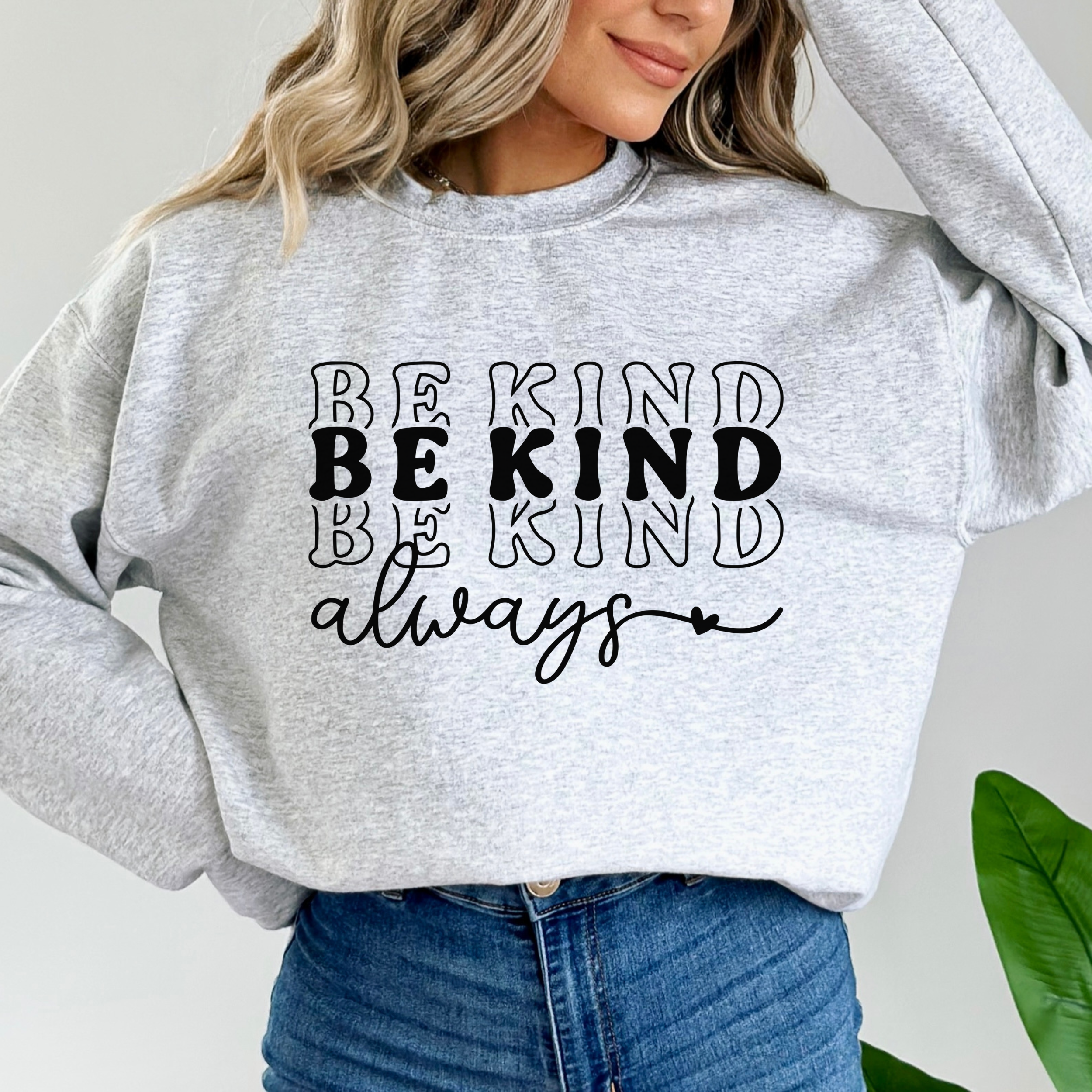 A soft, grey sweatshirt with the phrase Be Kind Always written.